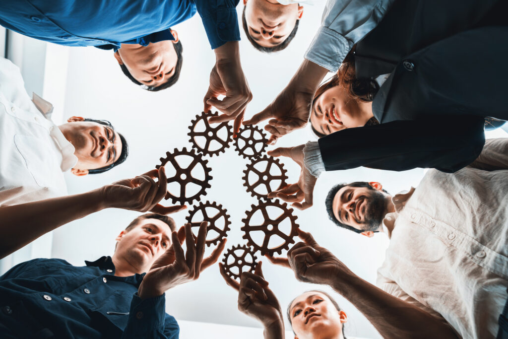 Business team joining cogwheel in circular together symbolize successful group of business partnership and strong collective unity teamwork in community workplace with productive efficiency.